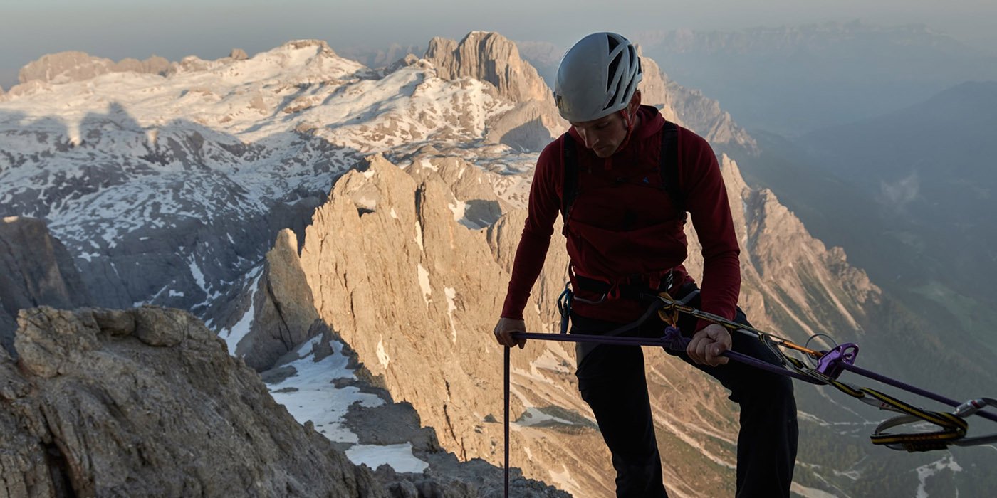 mountain climber wearing klattermusen mountaineering equipment
