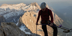 mountain climber wearing klattermusen outdoor technical clothing