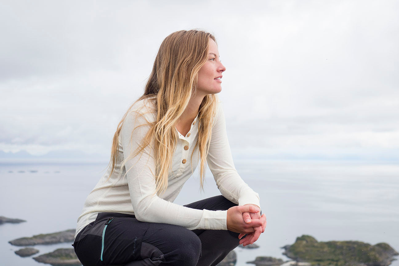 woman climbing in organic wool and silk longsleeve shirt by northern playground