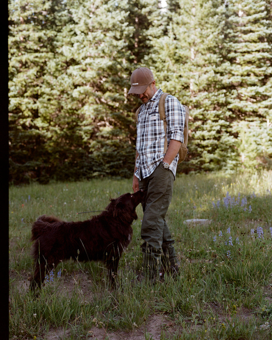 man wearing amundsen skauen field shirt with his dog