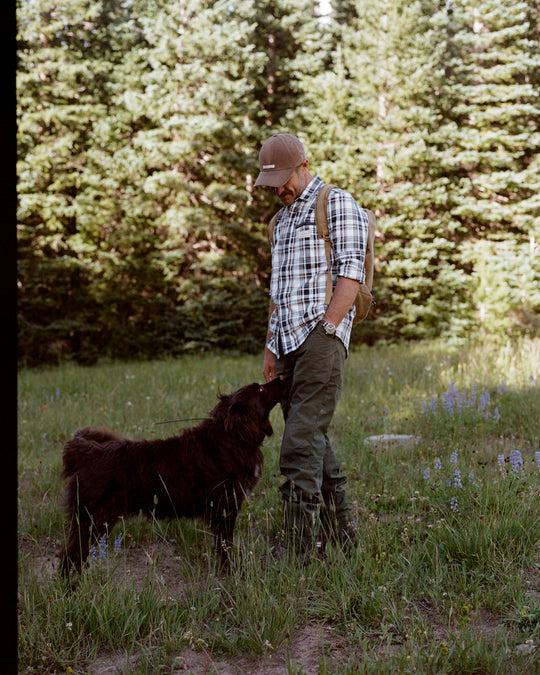 man wearing amundsen skauen field shirt with his dog