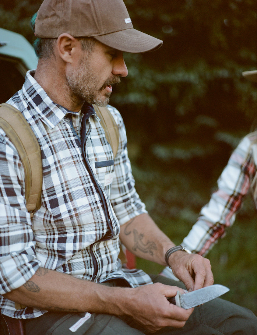 man wearing amundsen skauen field shirt in antarctic tartan