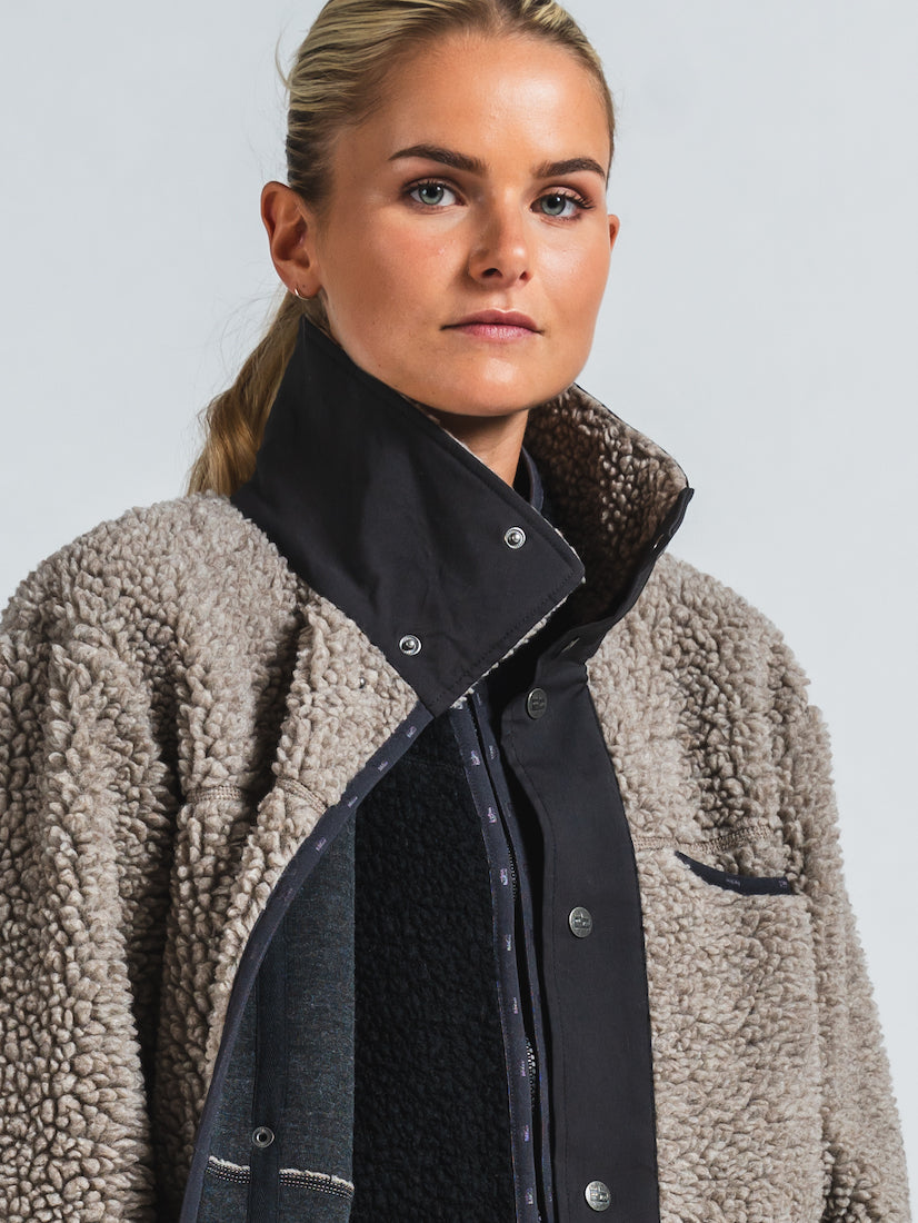 woman wearing varg koster long wool coat