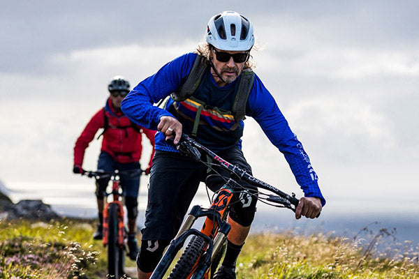 two men mountain biking in elevenate cycling clothing