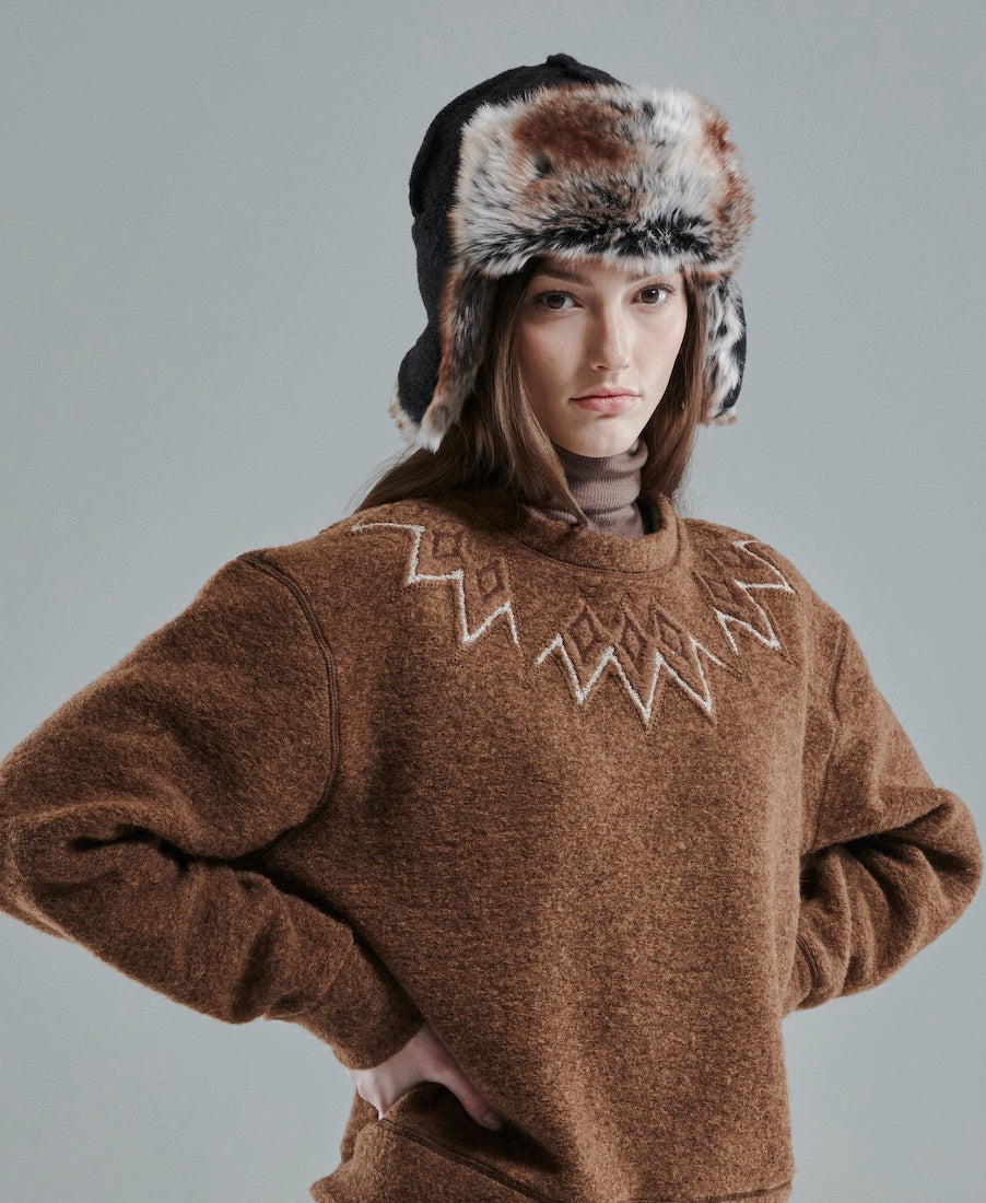woman wearing 66 north kaldi arctic hat in black