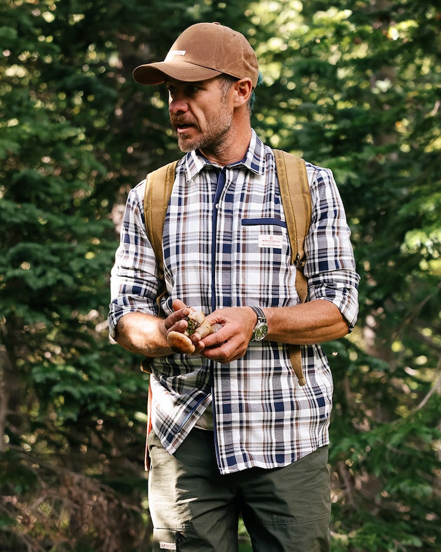 man wearing amundsen skauen field shirt in antarctic tartan