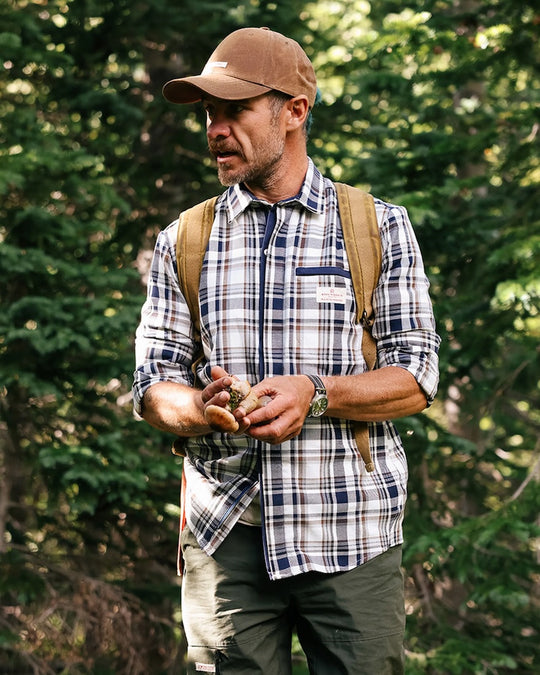 man wearing amundsen skauen field shirt in antarctic tartan