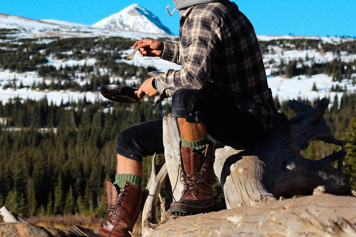 man camping in pants by amundsen sports for aktiv scandinavian outdoor clothing
