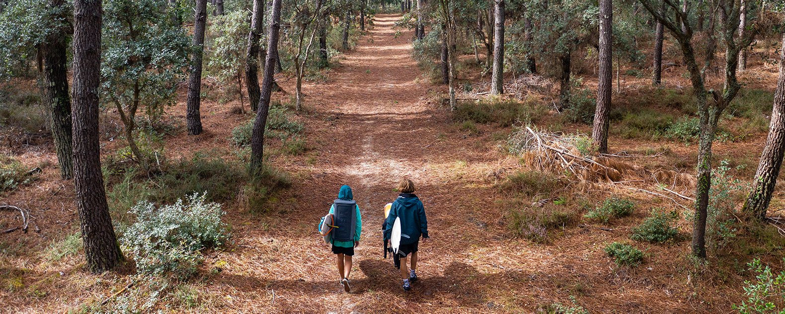 couple wearing fw clothing while backpacking in the mountains