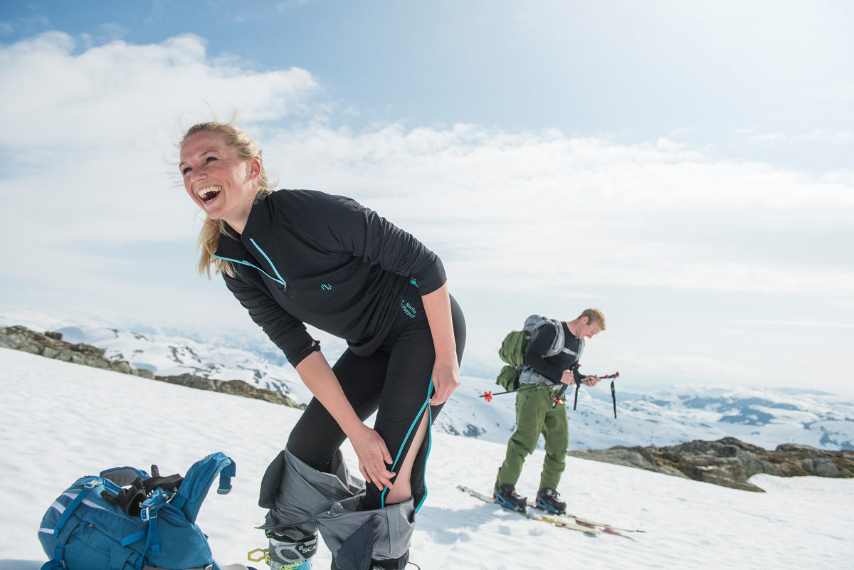 woman showing off her ski base layers