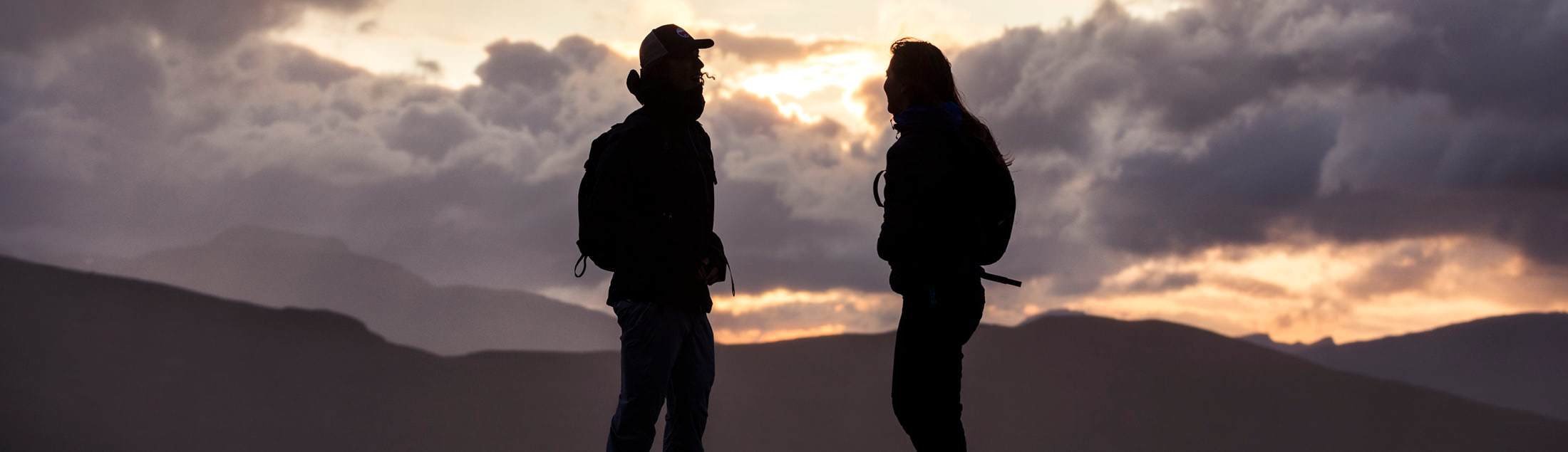 two hikers in the mountains wearing elevenate outdoor clothing