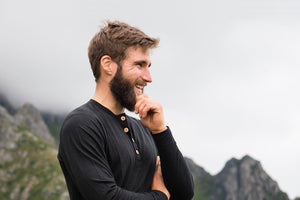 man hiking in organic wool and silk longsleeve shirt by northern playground for aktiv activewear