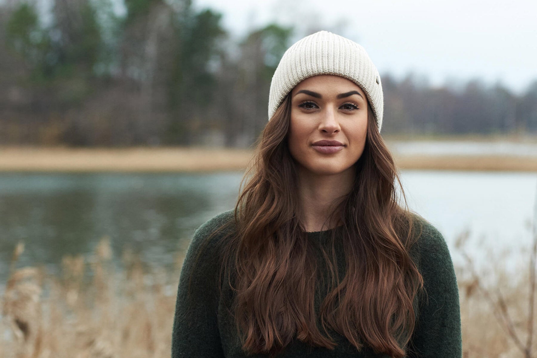 woman wearing a superyellow merino wool beanie