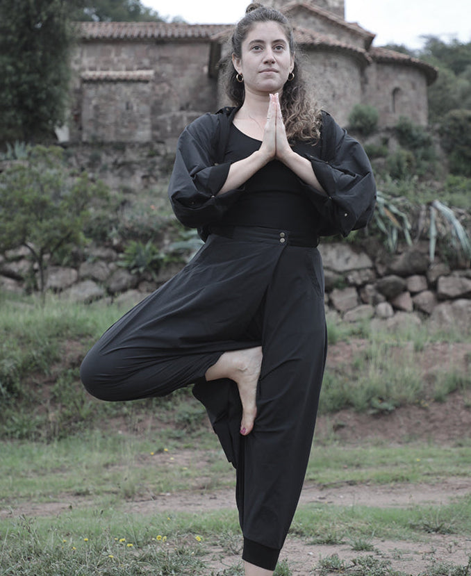 woman doing yoga in elke nyc convertible pants