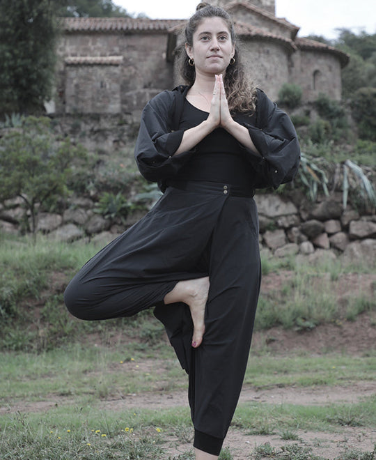 woman doing yoga in elke nyc convertible pants