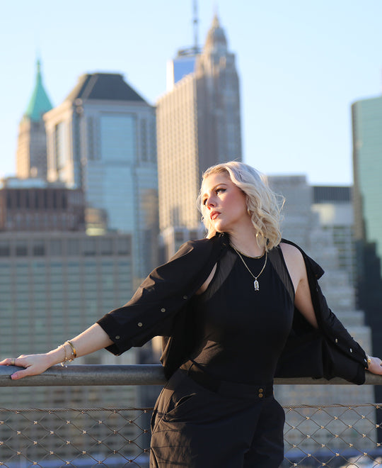 woman in front of the nyc skyline wearing elke nyc lightweight apparel