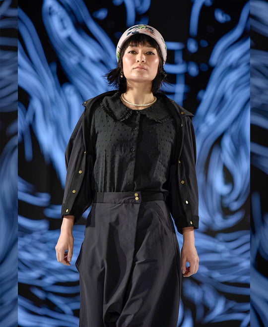 woman walking a runway in elke nyc apparel