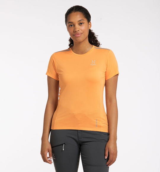 Front view of model in Haglofs L.I.M.Tech Tee in orange.