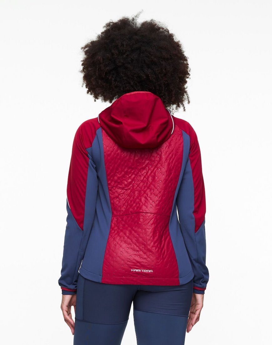 Back view of model wearing Tirill 2.0 jacket in red and navy.