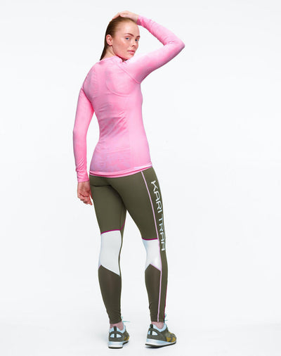 Back view of model wearing long sleeve pink shirt with butterflies. 