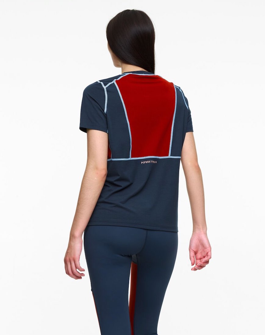 Back view of model wearing multi colored tee shirt by Kari Traa.