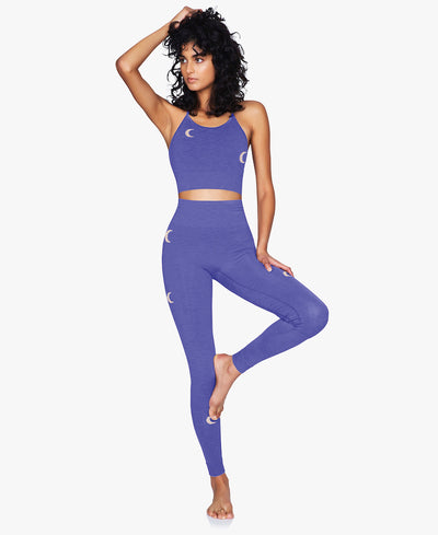 Solstice Midi Bra Top in Blue Iris Purple with Silver Moons for Yoga and Pilates or other low impact sports with matching leggings on Model