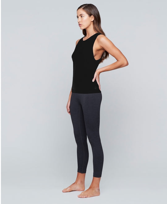 Woman wearing black tank top by Moonchild Yoga Wear