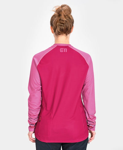 Back view of model wearing Allmountain long sleeve shirt in hot pink with light pink sleeves.