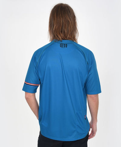 Back view of model wearing Allmountain short sleeve T-shirt in blue.