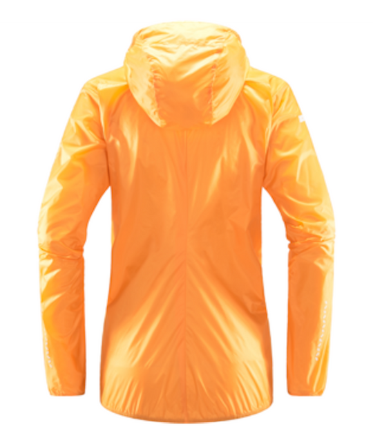 Back view of bright orange lightweight windbreaker by Haglofs with hood.