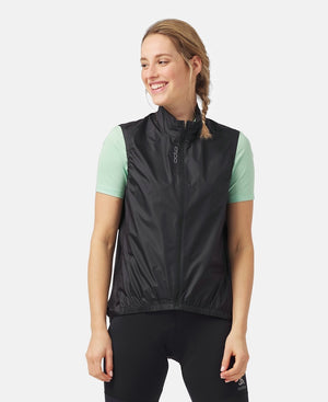 Front view of model wearing essential windproof vest in black.