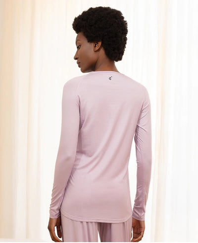 Back view of model wearing stay cool sleep long sleeve shirt in pink.