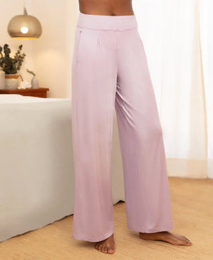 Front view of model wearing stay cool sleep pants in purple/pink.
