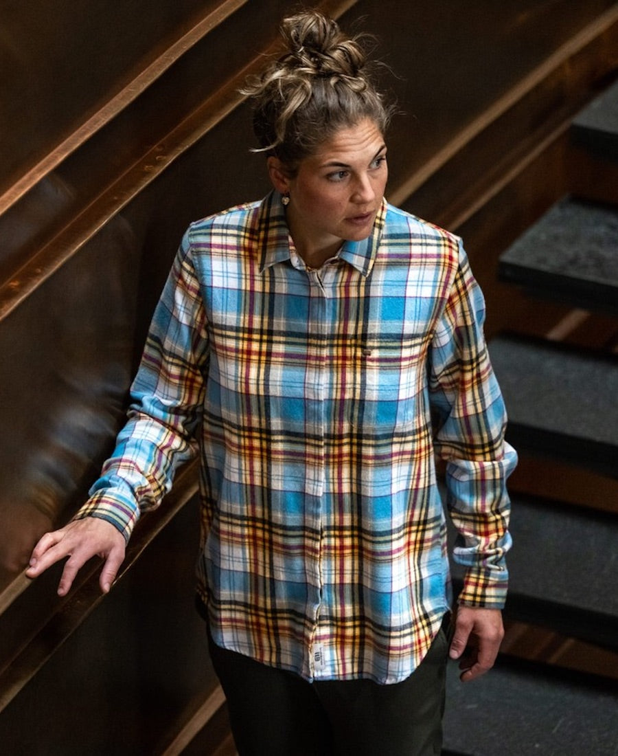 Front view of model wearing Vallee plaid flannel shirt.
