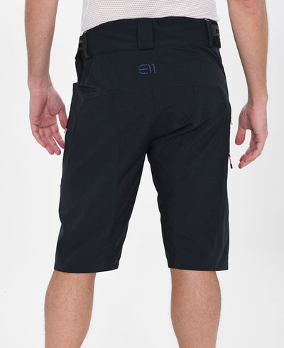 Back view of model wearing Chemin bike shorts in black