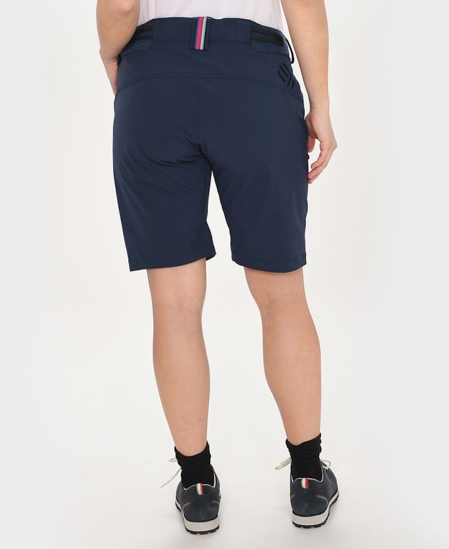 Back view of model wearing Versatility shorts in navy.