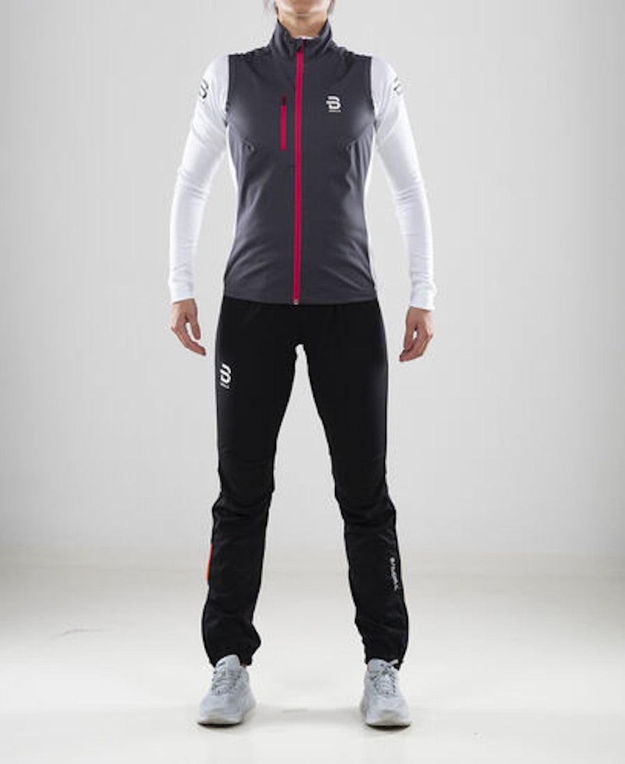 Dark running vest with pink zipper for women by Daehlie full view